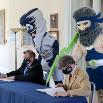 Mascots and Presidents Signing Agreement