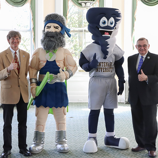 The SCCC President and the Centenary College President stand together with their mascots.