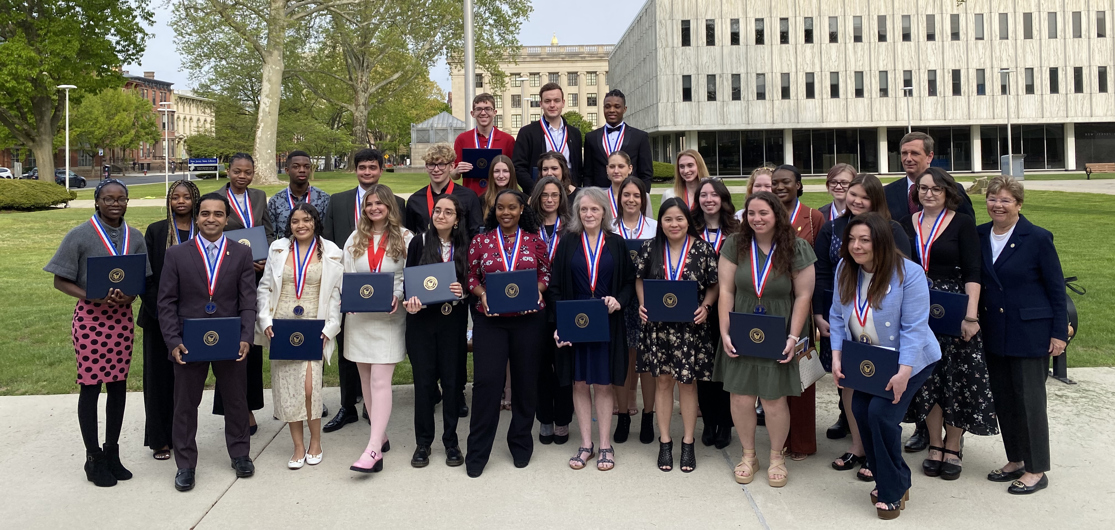 A group of students poses with their awards.