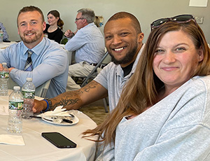 men and women sitting at a luncheon