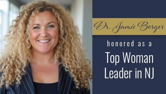 A woman with blonde curly hair.