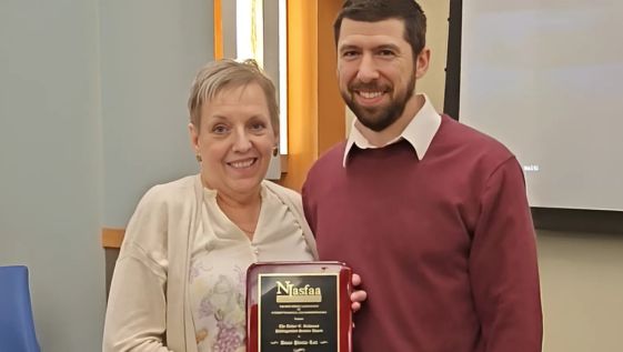 Diane Pienta-Lett accepts Distinguished Service Award