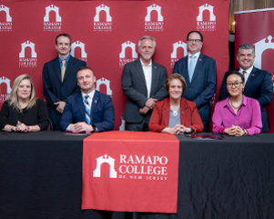 A group of Professionals gather for a photo
