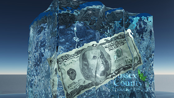 A$100 bill in a block of ice.