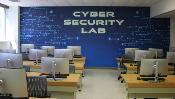 A classroom with a wall that says Cyber Security Lab