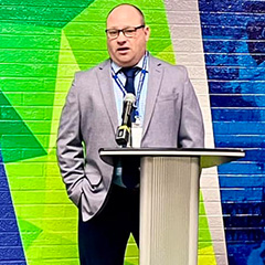 Man in front of podium